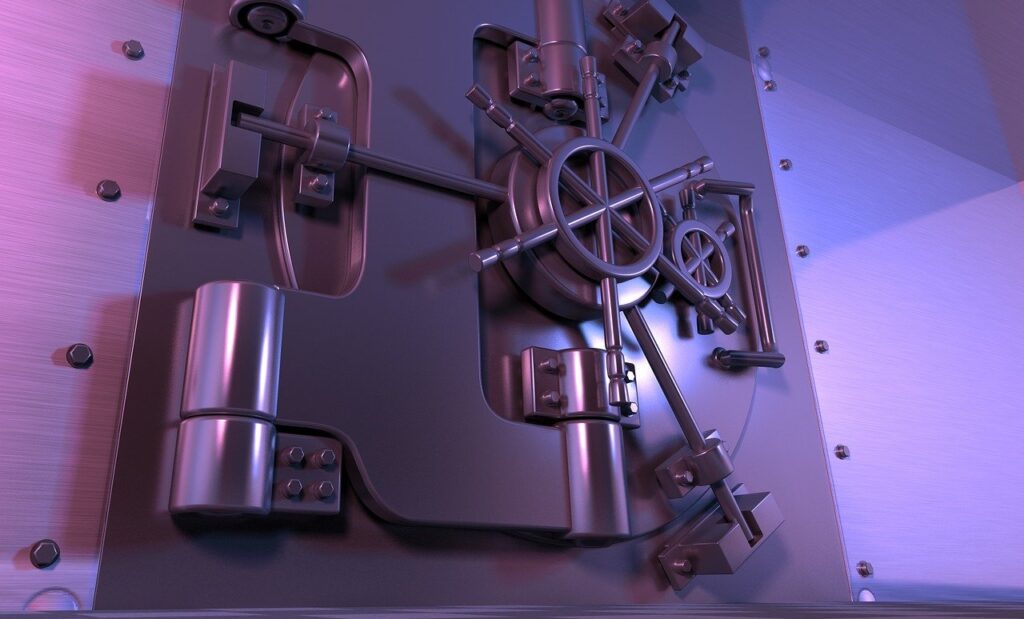Mostra uma grande porta de cofre, com tons roxos, o post fala sobre ter um Celular para Bancos, além do seu próprio.